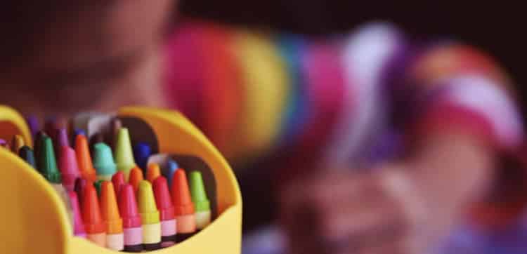Boy Coloring With Crayons