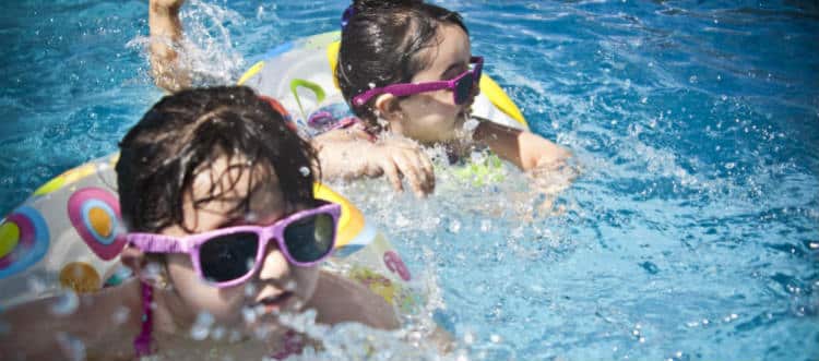 Kids In Summer Camp Swimming Pool