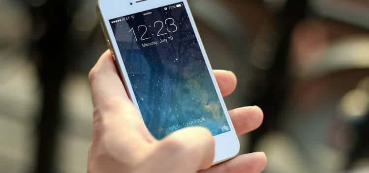Man Holding iPhone Man Holding iPhone