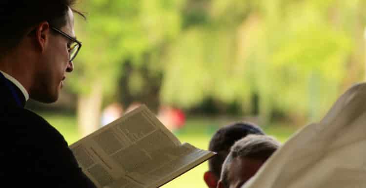 Priest Reading Bible
