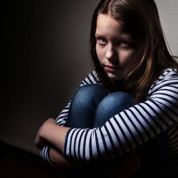 Sad Young Girl In Shadows