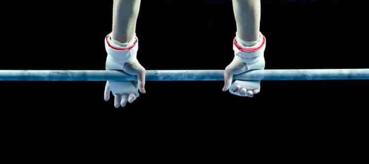 Young Gymnast On Parallel Bars