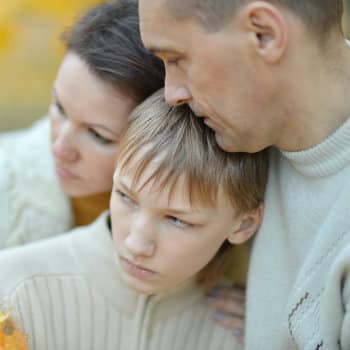 sad family of 3