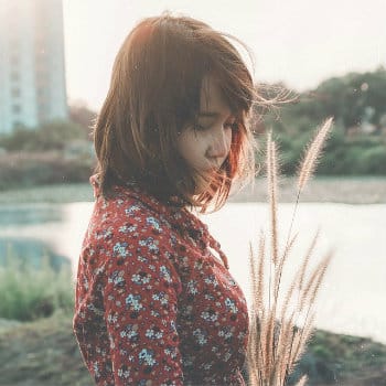 sad woman by river