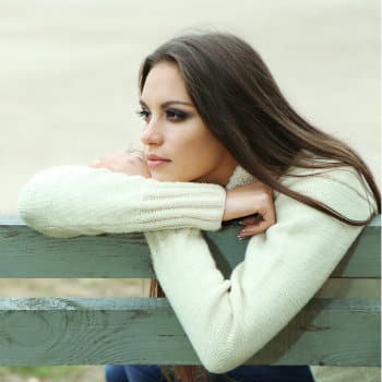 sad woman on park bench