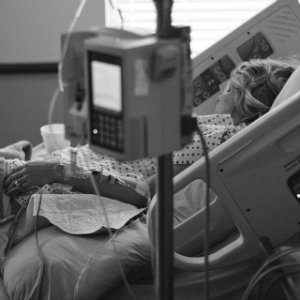 woman sleeping in hospital bed